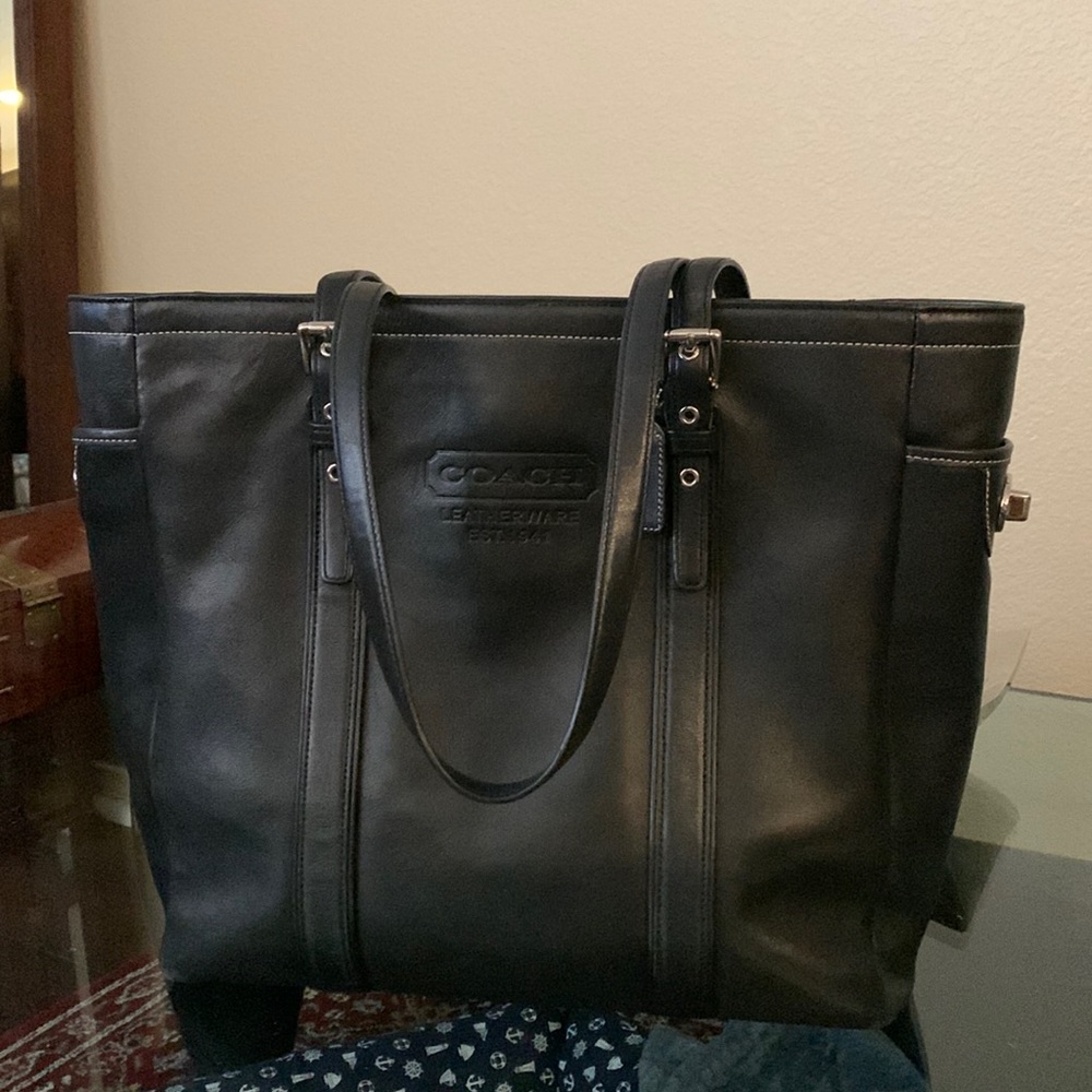 COACH genuine leather tote, silver tone fittings, adjustable shoulder straps.